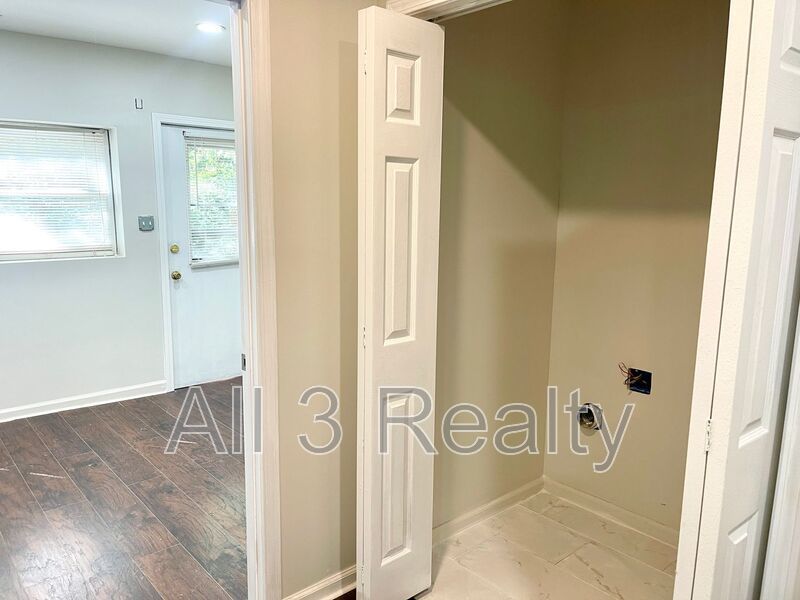 Welcome to this stunning 3-bedroom, 2-bathroom home located in the vibrant community of College Park, GA. property image