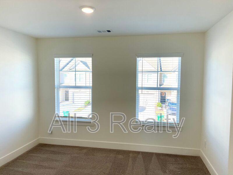 Welcome to this charming 3-bedroom, 2.5-bathroom home located in the vibrant community of Lithonia, GA. property image