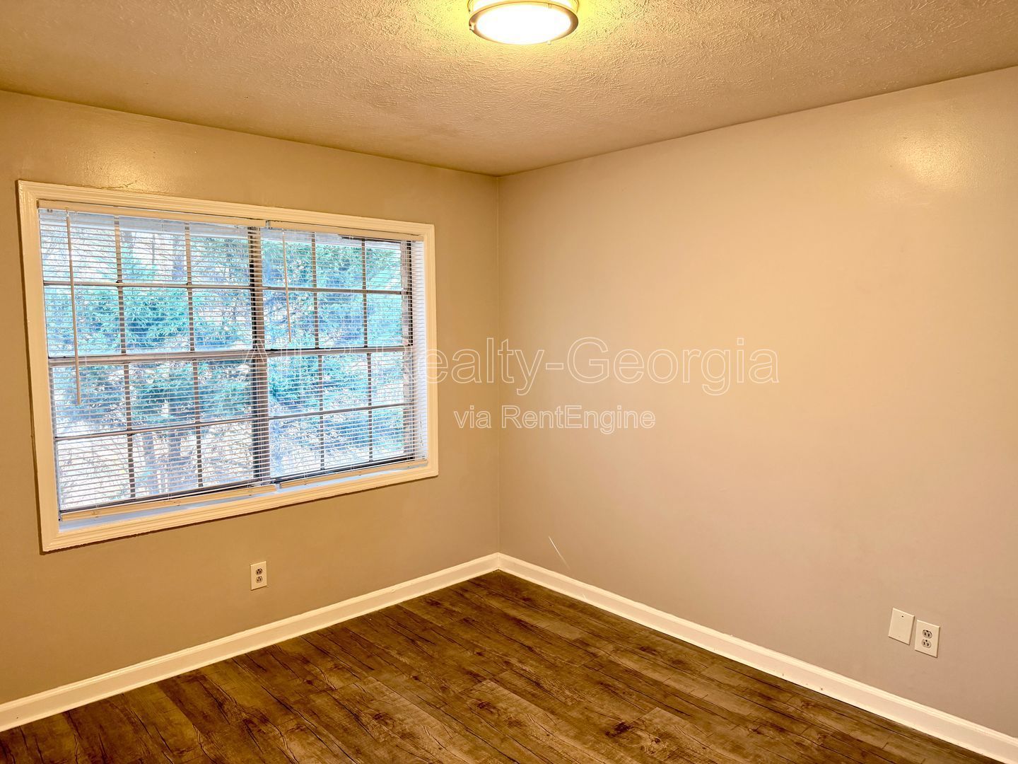 Welcome to this charming 2-bedroom, 1-bathroom home located in the vibrant community of Stockbridge, GA. Unit A-8 property image