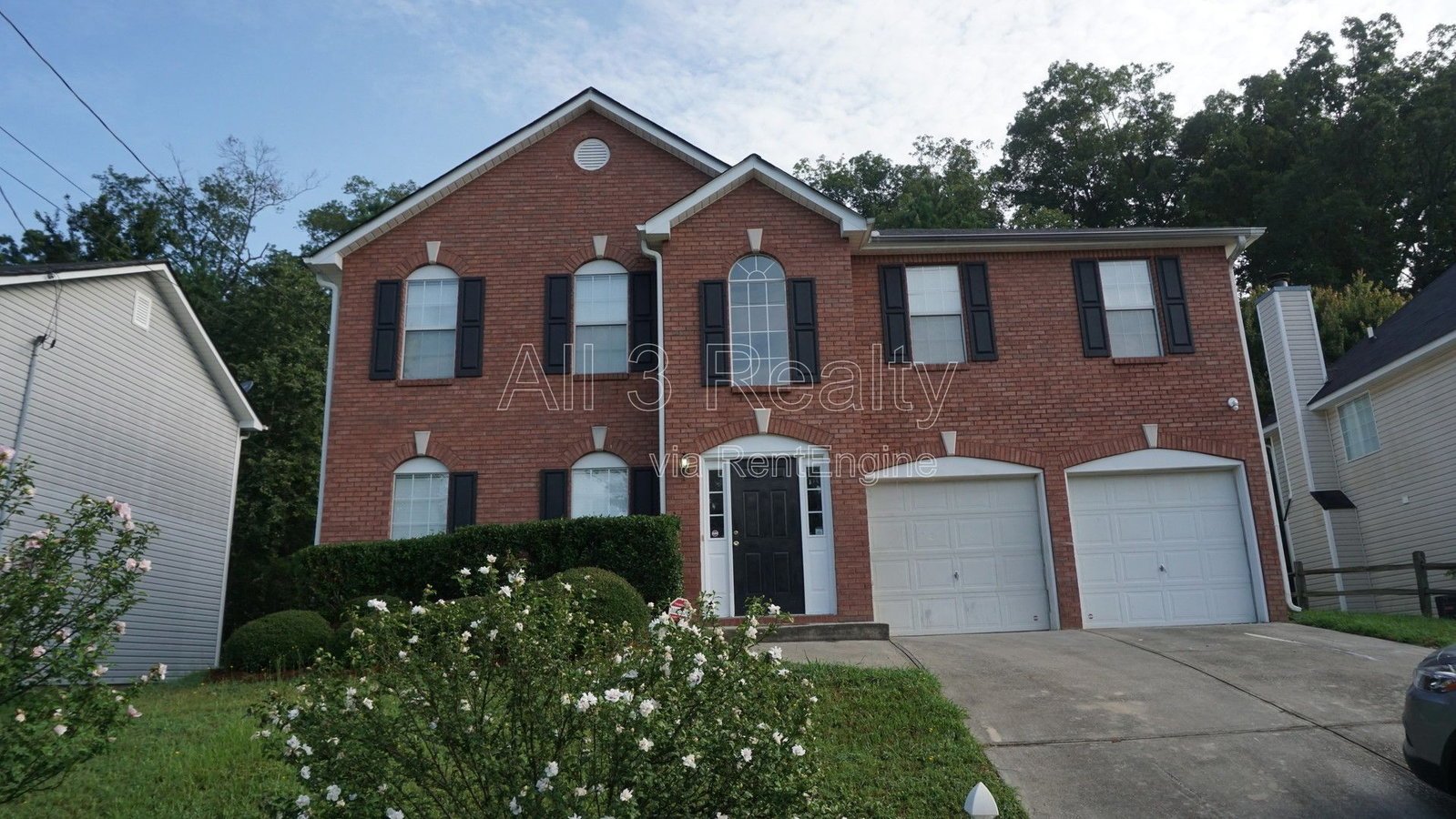 Charming 3-bedroom, 2.5-bath home in Lithonia, GA featuring a cozy fireplace and ceiling fans throughout. property image