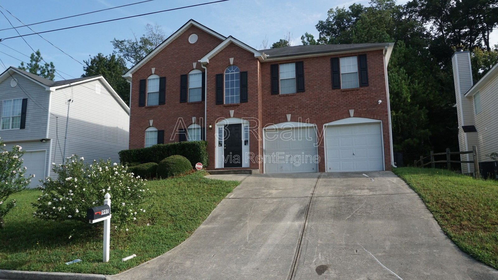 Charming 3-bedroom, 2.5-bath home in Lithonia, GA featuring a cozy fireplace and ceiling fans throughout. property image