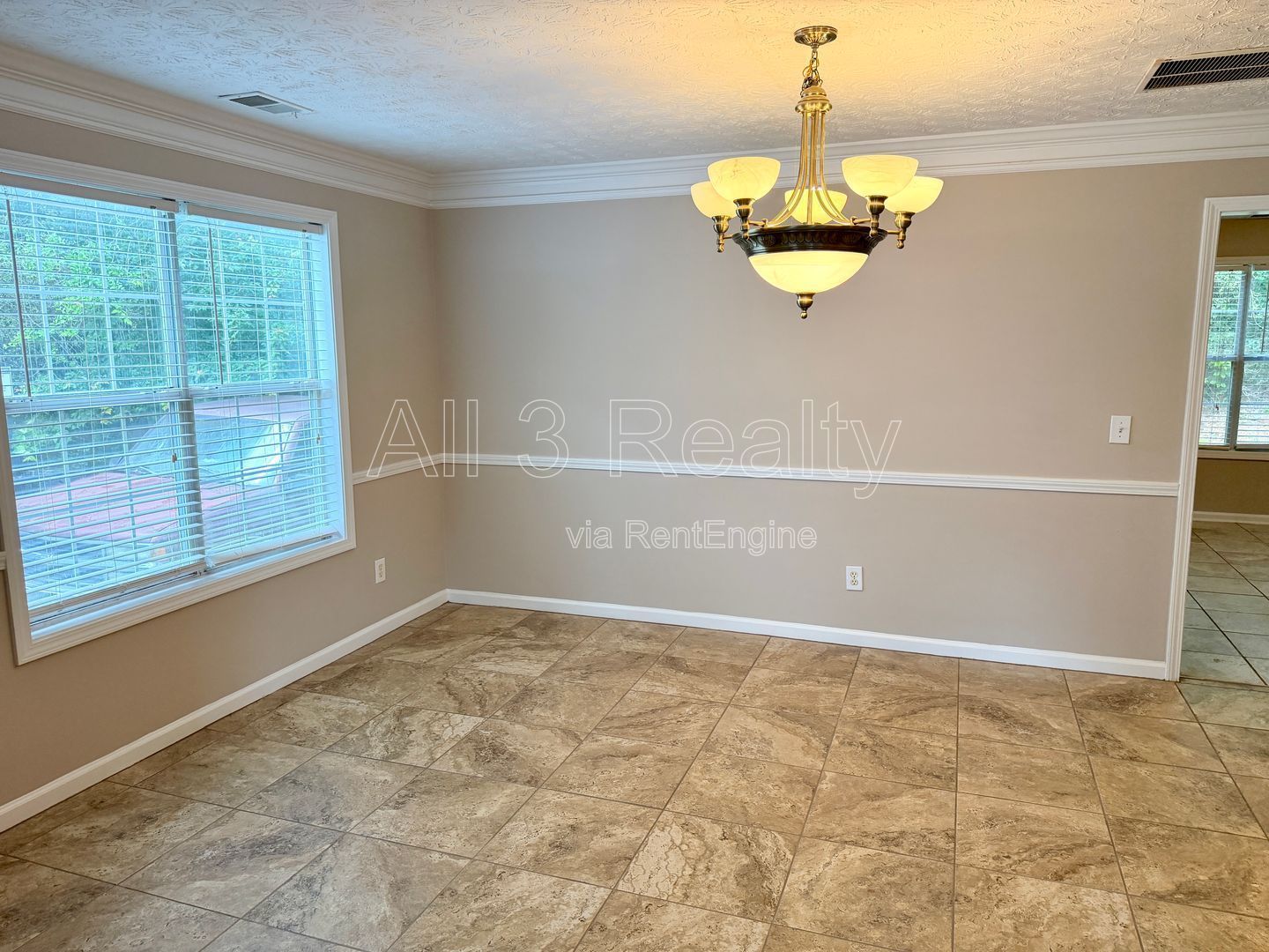 Charming 3-bedroom, 2.5-bath home in Lithonia, GA featuring a cozy fireplace and ceiling fans throughout. property image