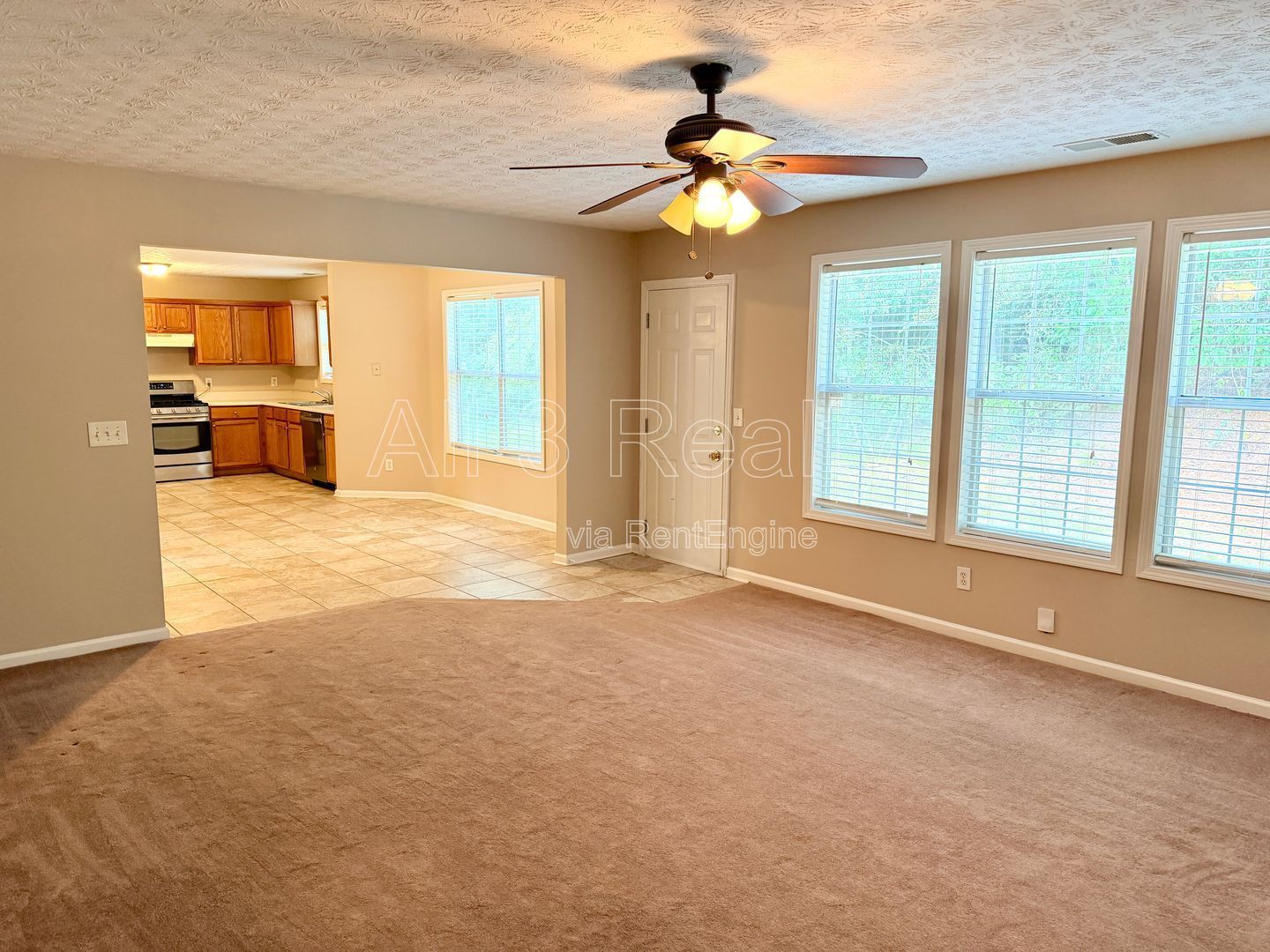 Charming 3-bedroom, 2.5-bath home in Lithonia, GA featuring a cozy fireplace and ceiling fans throughout. property image