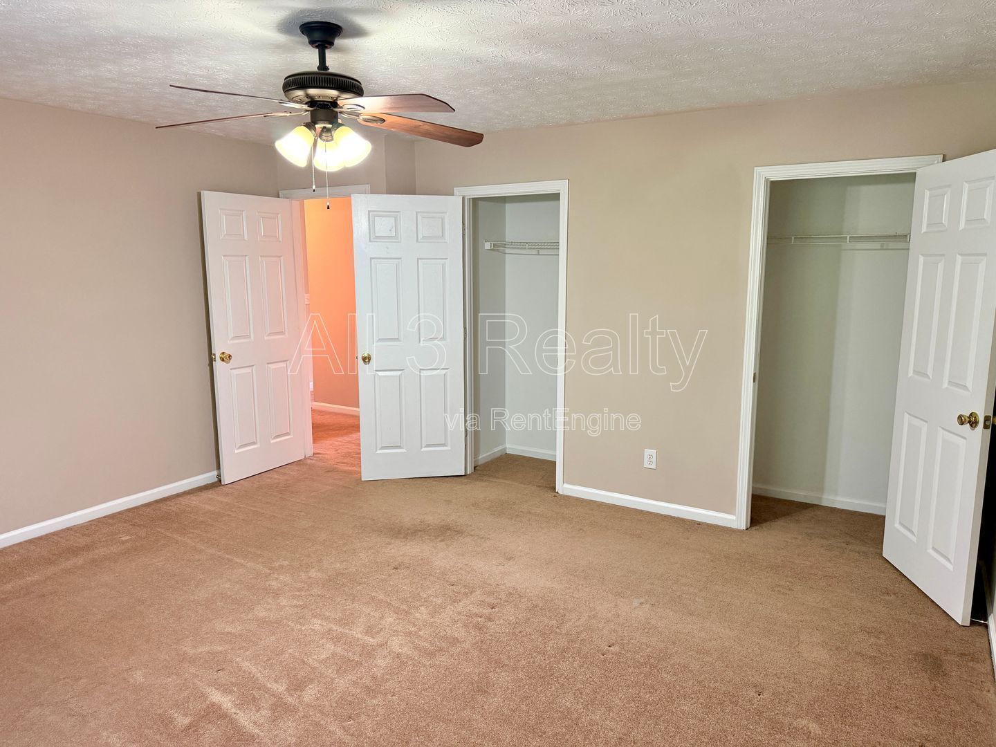 Charming 3-bedroom, 2.5-bath home in Lithonia, GA featuring a cozy fireplace and ceiling fans throughout. property image