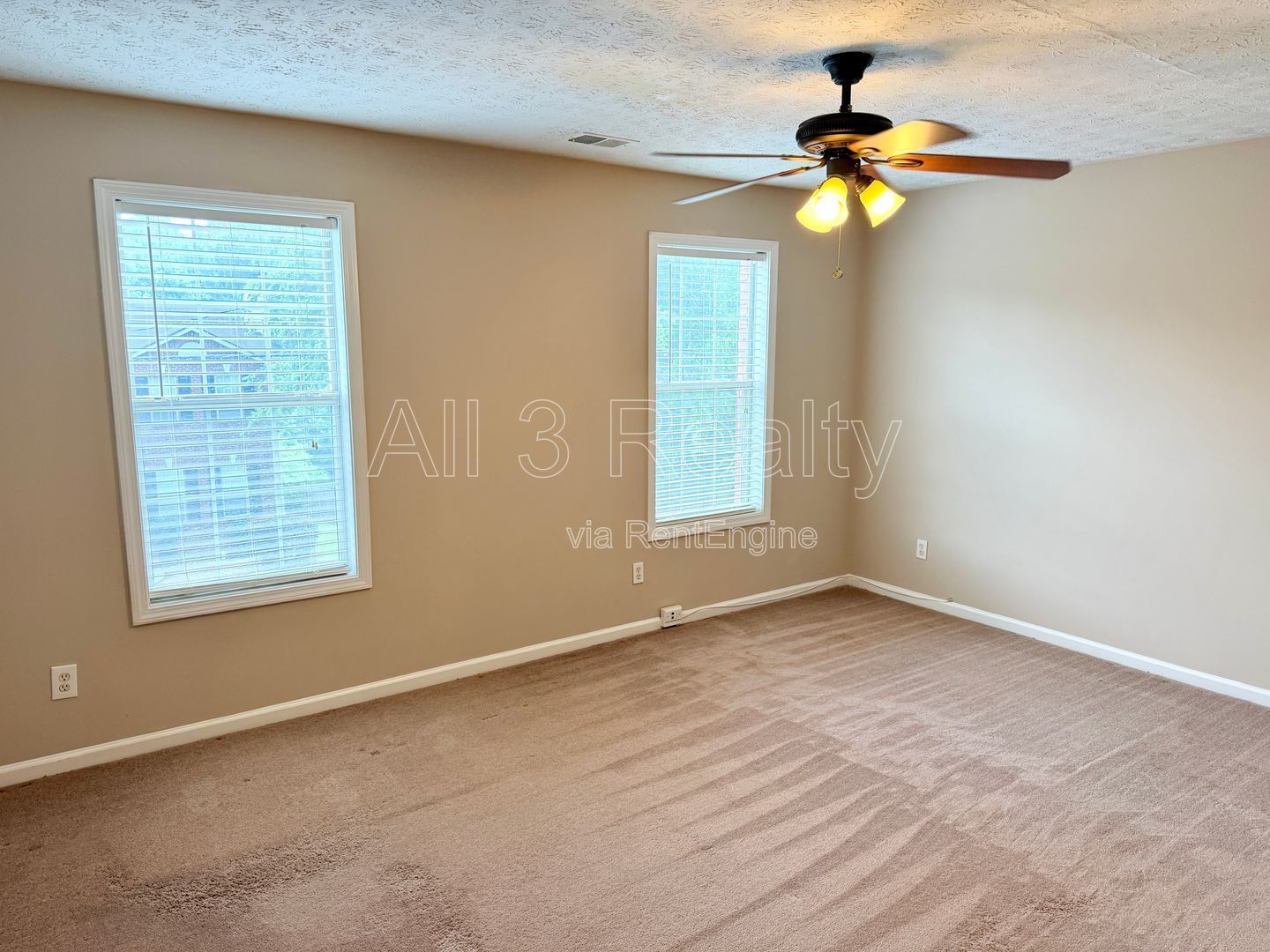 Charming 3-bedroom, 2.5-bath home in Lithonia, GA featuring a cozy fireplace and ceiling fans throughout. property image