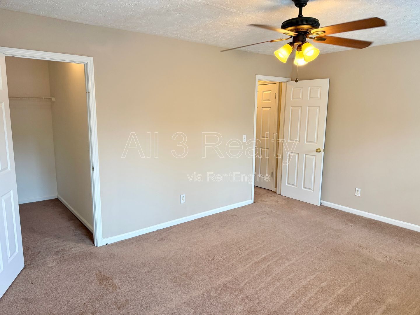 Charming 3-bedroom, 2.5-bath home in Lithonia, GA featuring a cozy fireplace and ceiling fans throughout. property image
