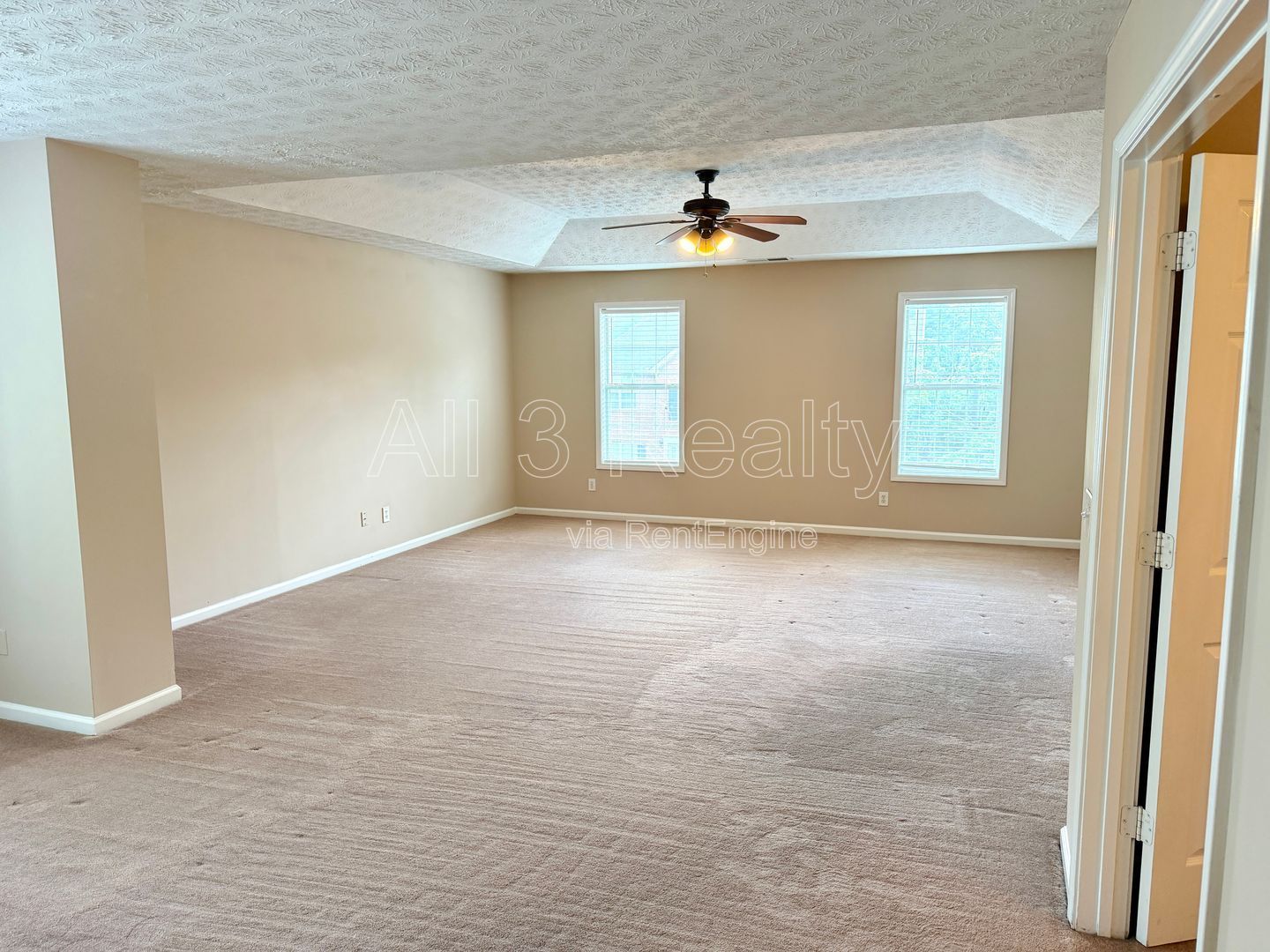 Charming 3-bedroom, 2.5-bath home in Lithonia, GA featuring a cozy fireplace and ceiling fans throughout. property image
