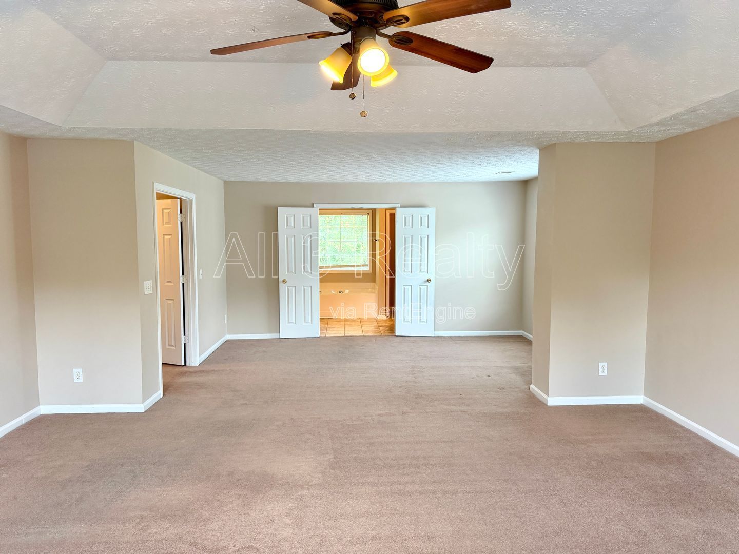 Charming 3-bedroom, 2.5-bath home in Lithonia, GA featuring a cozy fireplace and ceiling fans throughout. property image