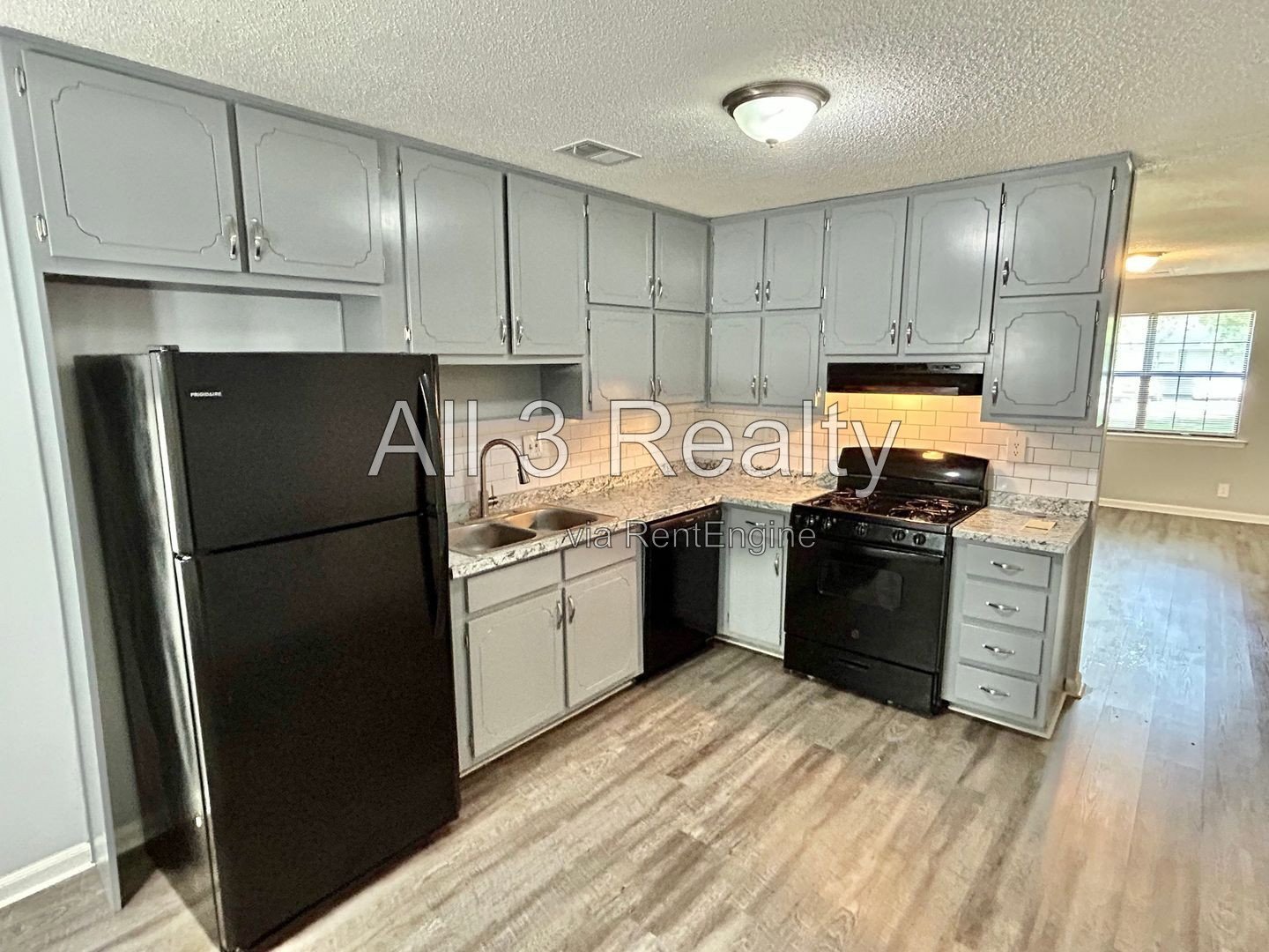 Charming 2-bedroom, 1.5-bath home in Jonesboro, GA featuring a cozy fireplace and a well-equipped kitchen with ample cabinet storage. property image