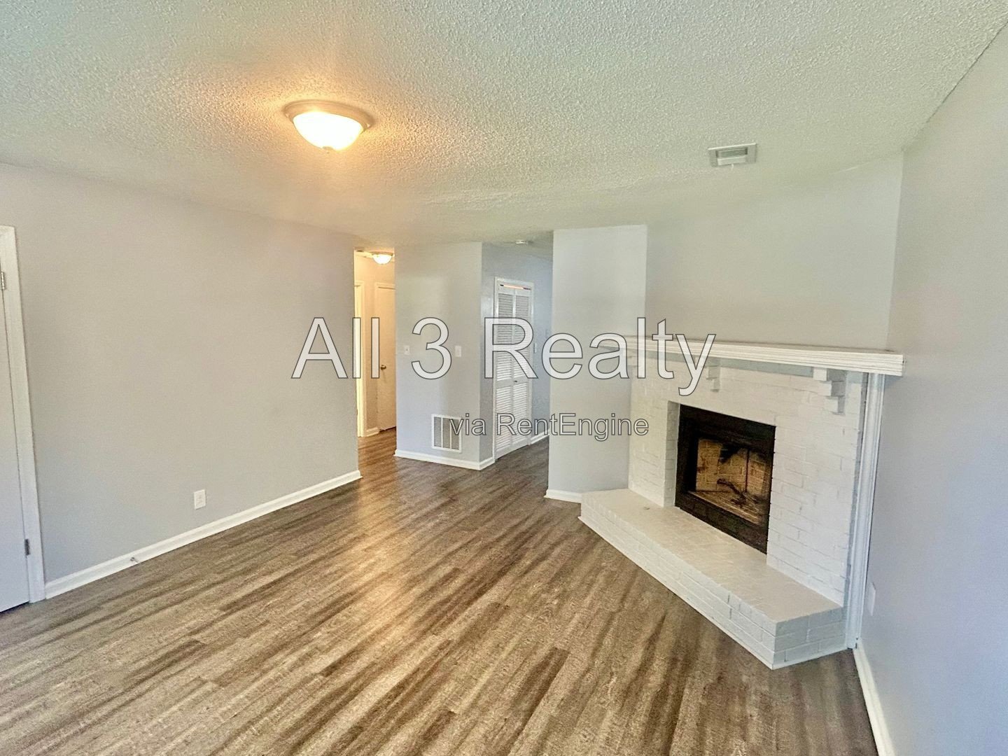 Charming 2-bedroom, 1.5-bath home in Jonesboro, GA featuring a cozy fireplace and a well-equipped kitchen with ample cabinet storage. property image