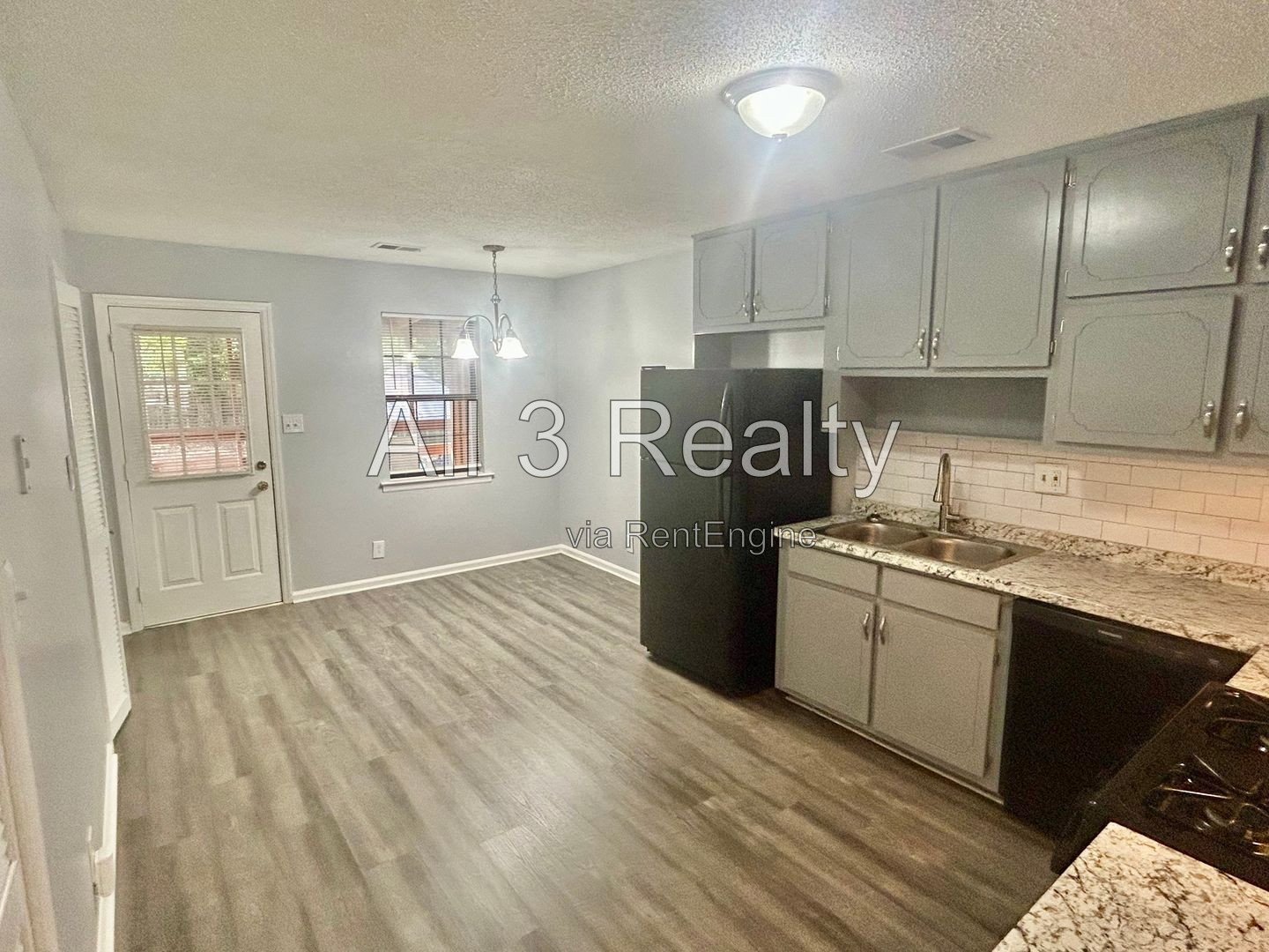 Charming 2-bedroom, 1.5-bath home in Jonesboro, GA featuring a cozy fireplace and a well-equipped kitchen with ample cabinet storage. property image