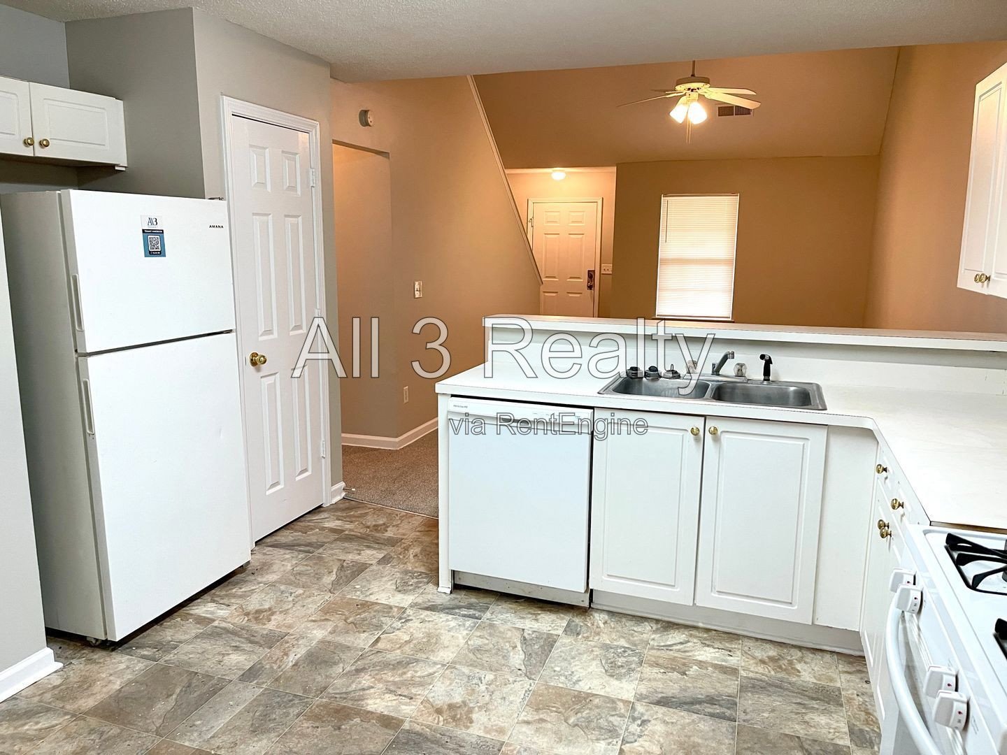 Charming 3-bedroom, 2.5-bath home in McDonough, GA featuring comfortable carpeted living spaces and ceiling fans throughout. property image