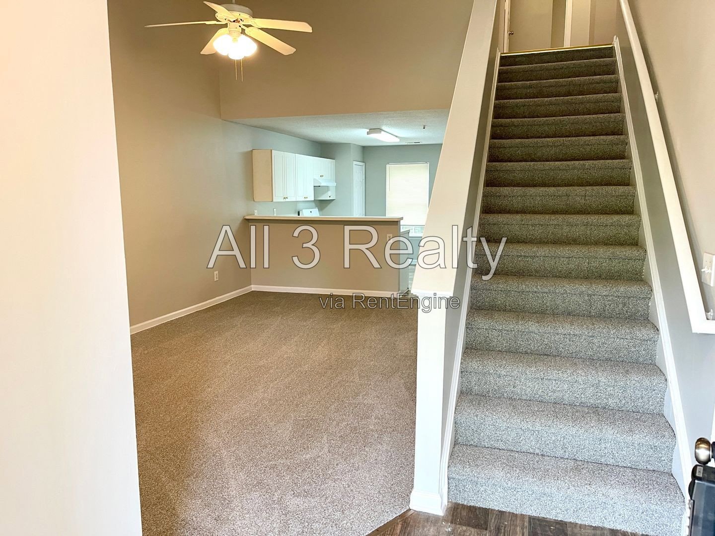 Charming 3-bedroom, 2.5-bath home in McDonough, GA featuring comfortable carpeted living spaces and ceiling fans throughout. property image