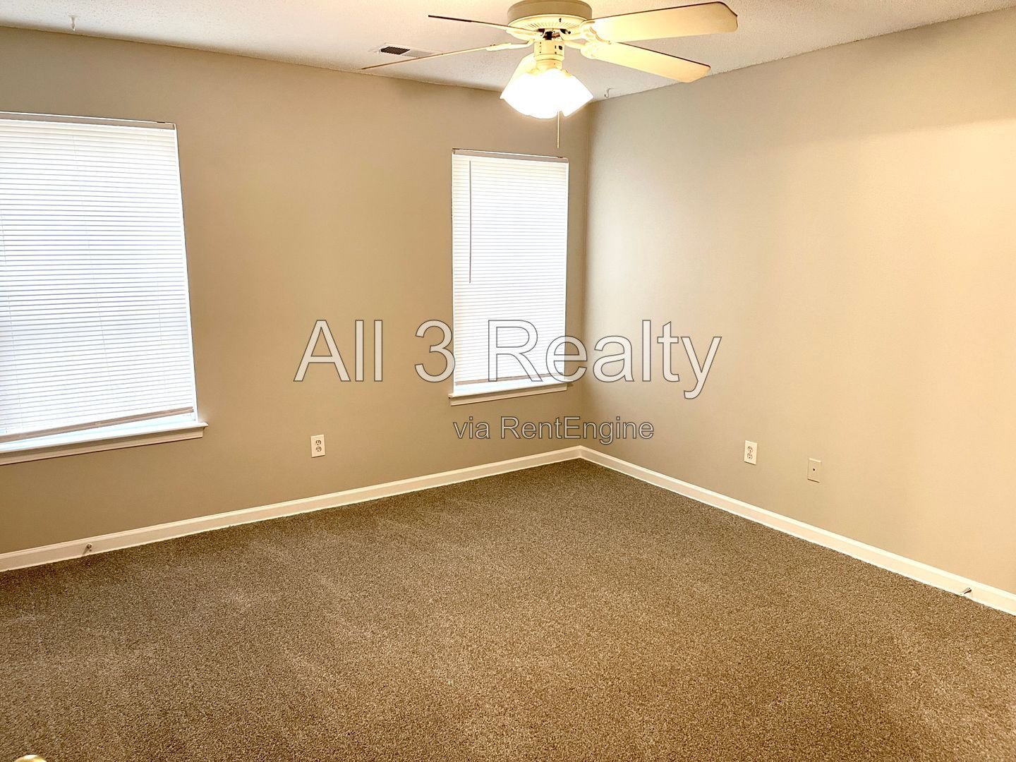 Charming 3-bedroom, 2.5-bath home in McDonough, GA featuring comfortable carpeted living spaces and ceiling fans throughout. property image
