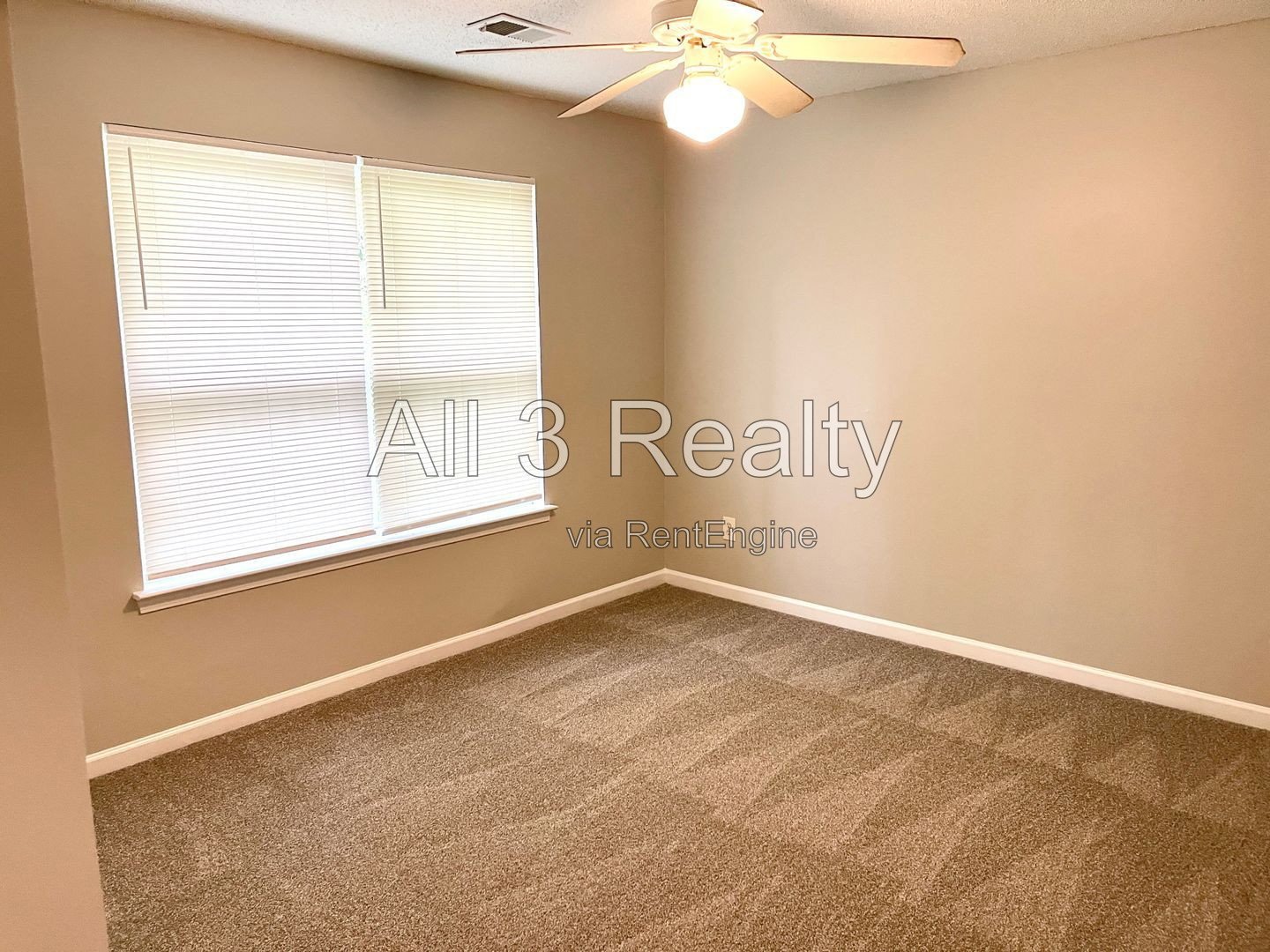 Charming 3-bedroom, 2.5-bath home in McDonough, GA featuring comfortable carpeted living spaces and ceiling fans throughout. property image