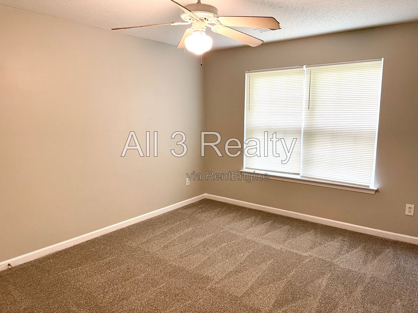 Charming 3-bedroom, 2.5-bath home in McDonough, GA featuring comfortable carpeted living spaces and ceiling fans throughout. property image