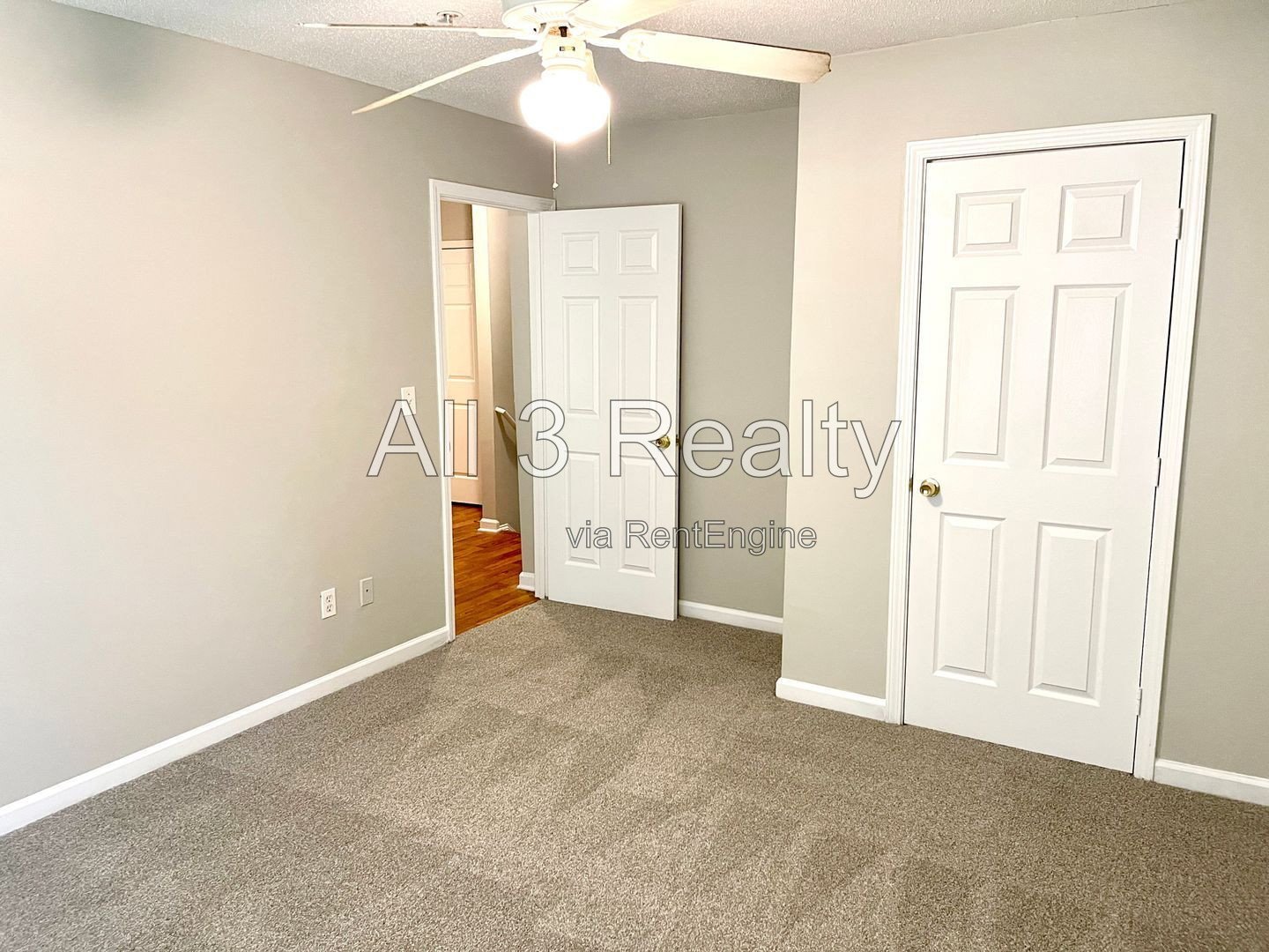 Charming 3-bedroom, 2.5-bath home in McDonough, GA featuring comfortable carpeted living spaces and ceiling fans throughout. property image